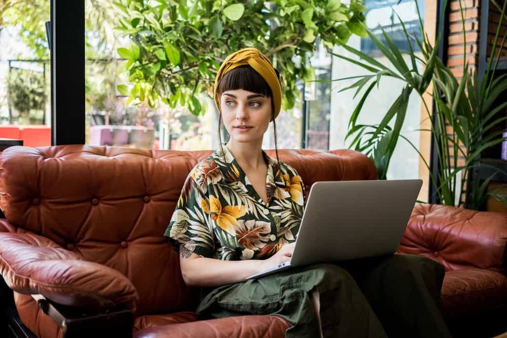 Actress writing her acting resume on a laptop