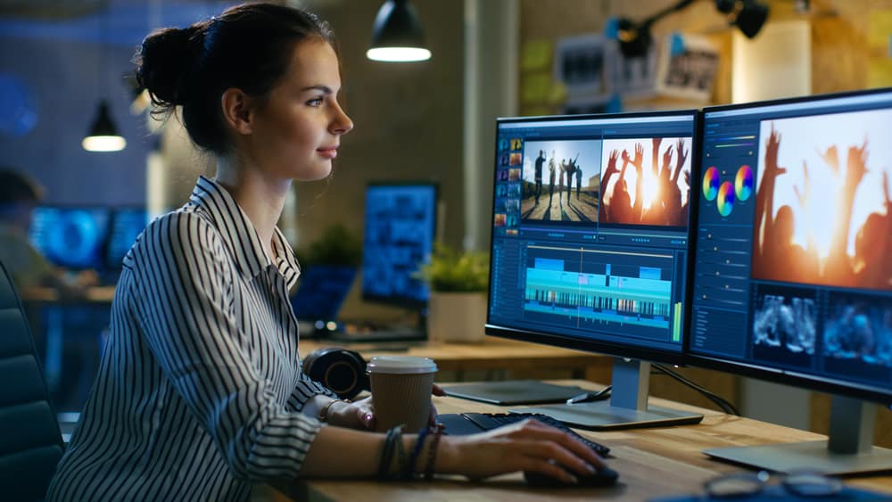 Post Supervisor working on post-production on her computer