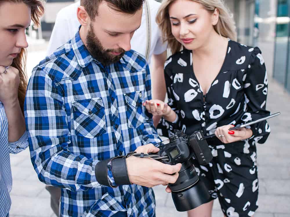Filmmaker and PA looking at camera on set